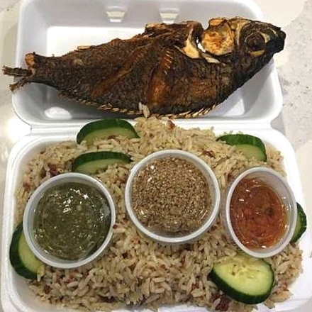 Liberian Dry Rice with Fried Fish at Liberian Cuisine Bar and Grill in Edmonton